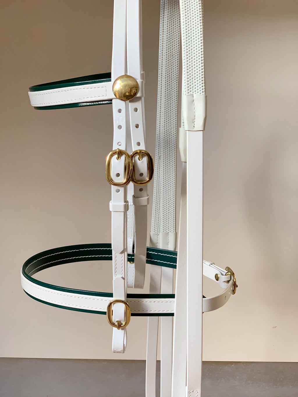 White and Green Biothane race bridle flat lay showing caveson noseband sssaddlery
